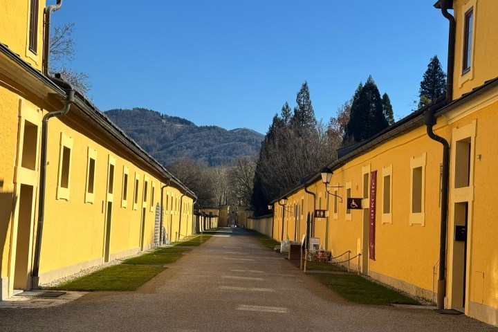 a train sitting on the side of a building