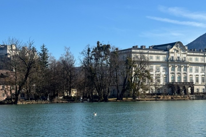 a large body of water with a city in the background