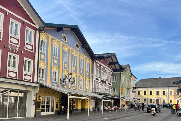 a group of people walking in front of a building