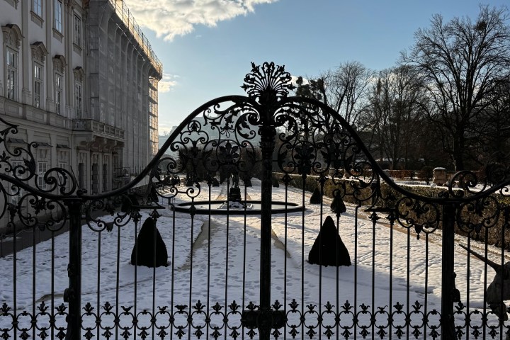 a group of people walking on a bridge