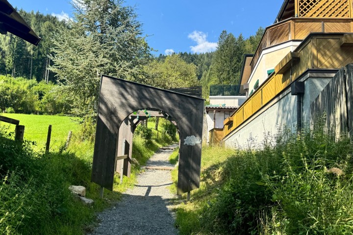 a house that has a sign on the side of a building