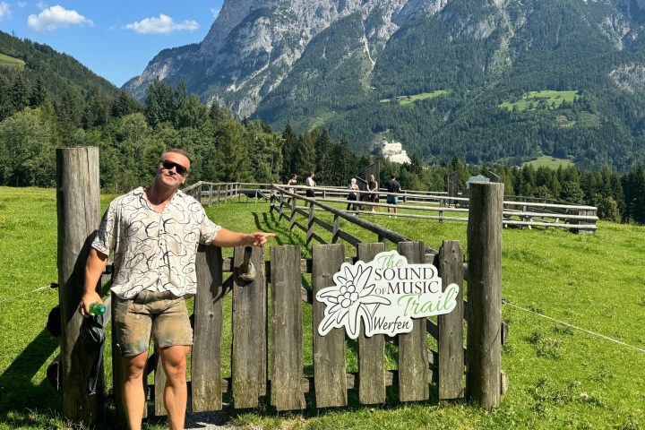 a person standing in front of a mountain