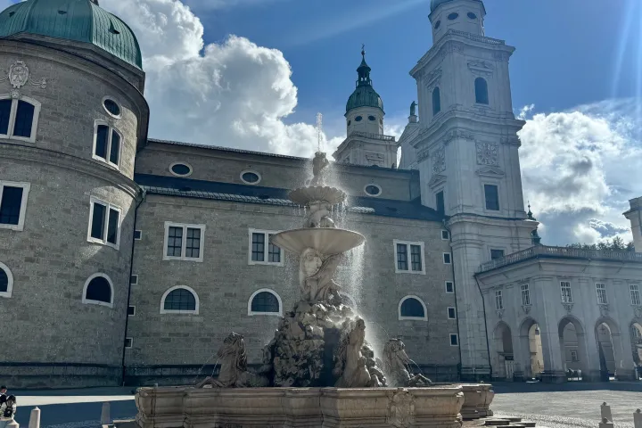 a group of people in front of a castle