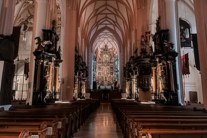a wooden statue in front of a building