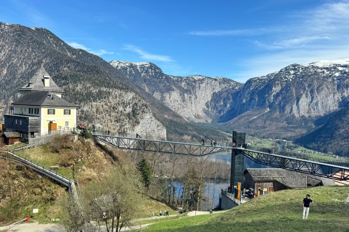 a train is parked on the side of a mountain