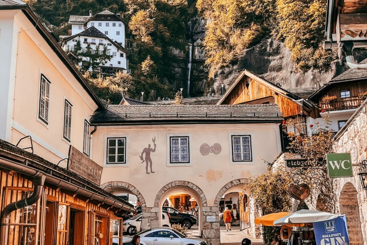 a group of people walking in front of a building