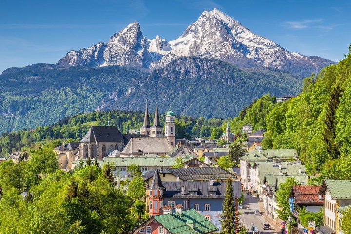 a house with a mountain in the background