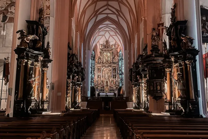 a room filled with furniture and vase in front of a building