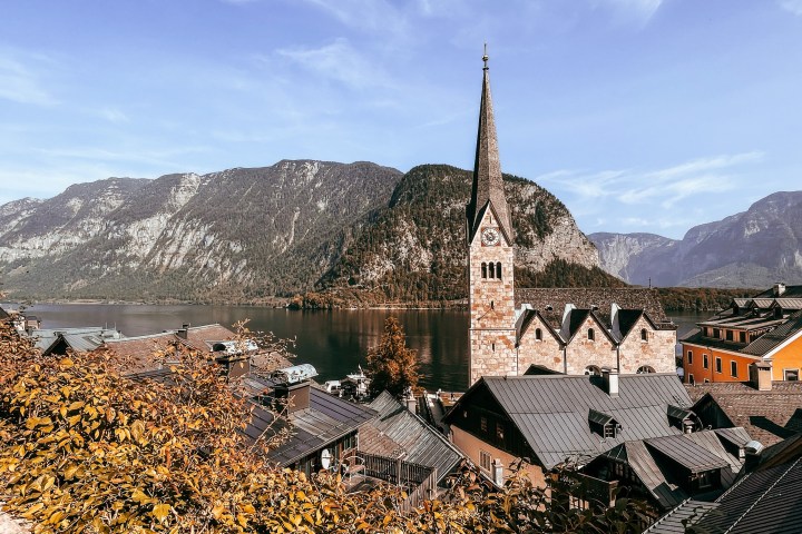 a castle like building with a mountain in the background