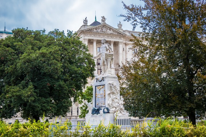 a small clock tower in front of a building