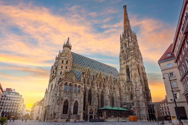a large clock tower towering over St. Stephen's Cathedral, Vienna