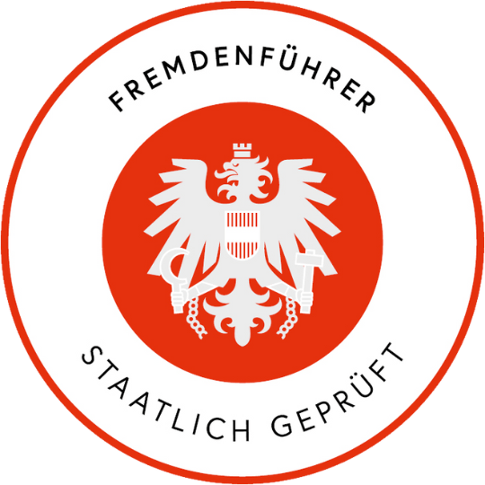 Austrian emblem with an eagle on a red circle, text 'Fremdenführer Staatlich Geprüft'.