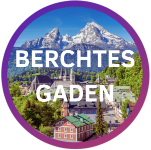Mountain town with text 'Berchtesgaden' over image, framed in purple circle.