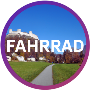 Castle on hill with path and FAHRRAD text in circle overlay.